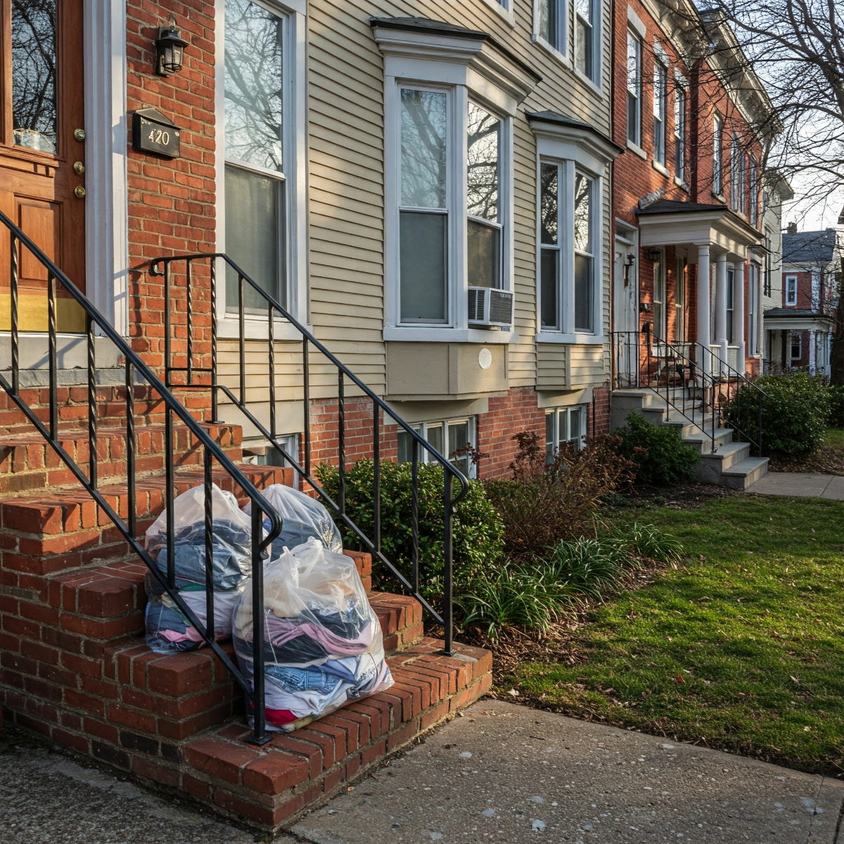 Dirty Laundry On Inner City Doorstep Waiting Outside For Pickup 1200X1200
